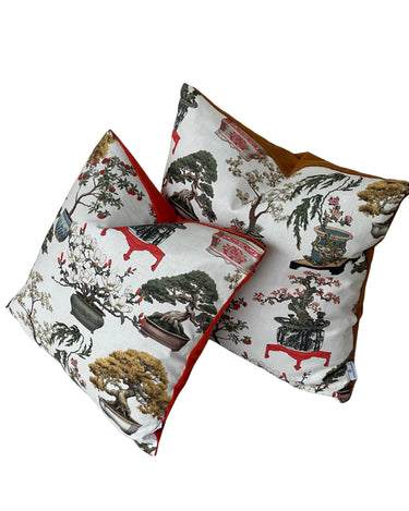 Botanical throw pillow featuring bonsai tree and floral vase design